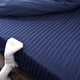 Putting the nozzle at the bottom of the bed is the ideal position if you want to share the breeze.